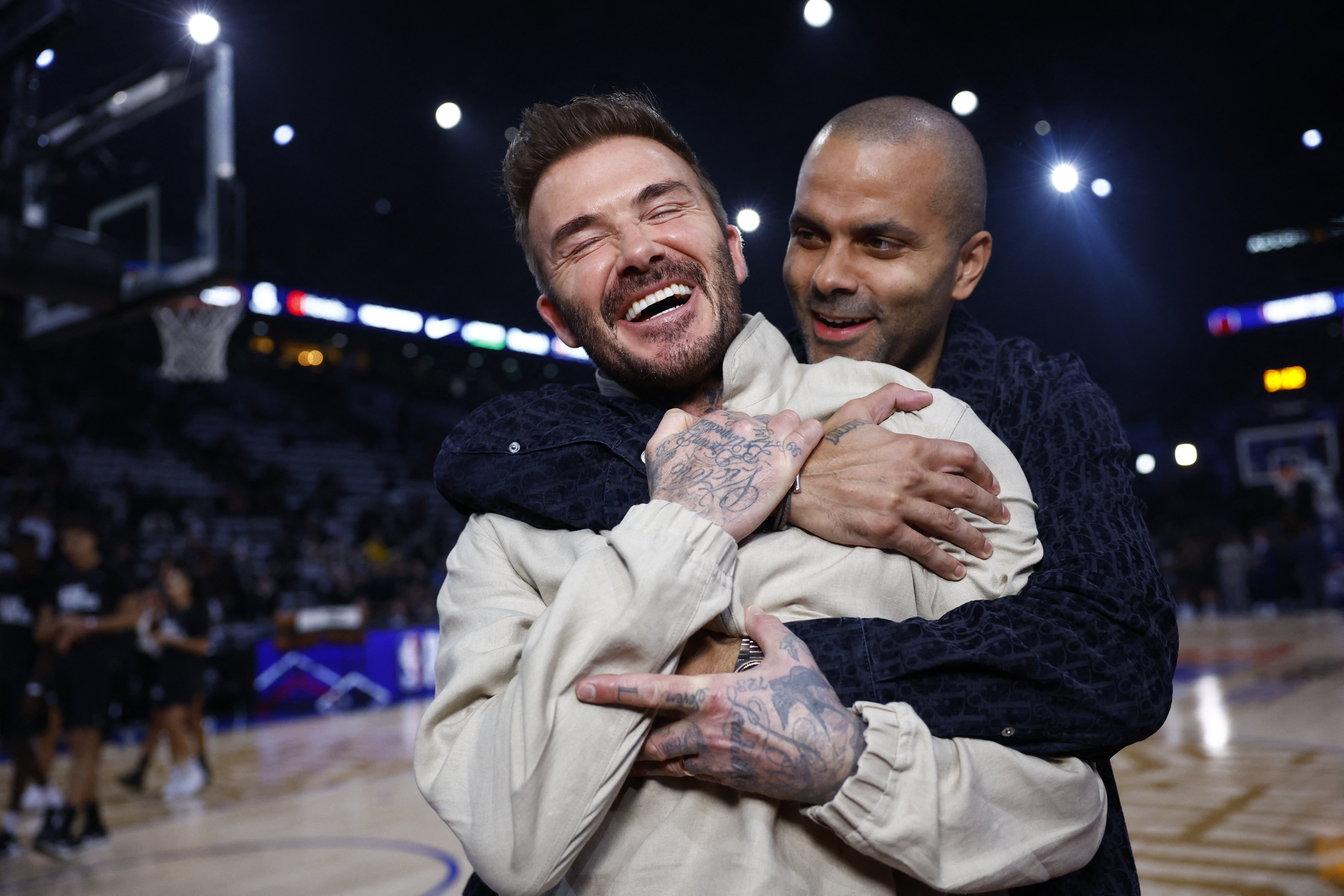 Parker hugs a beaming Becks