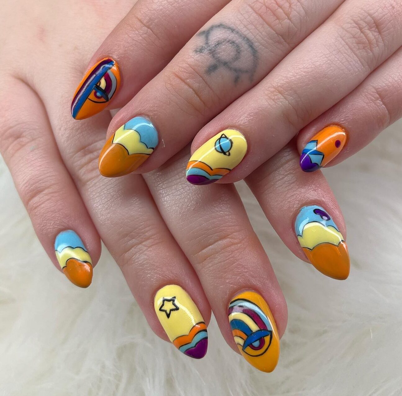 Multicolored abstract nail design on medium almond nails