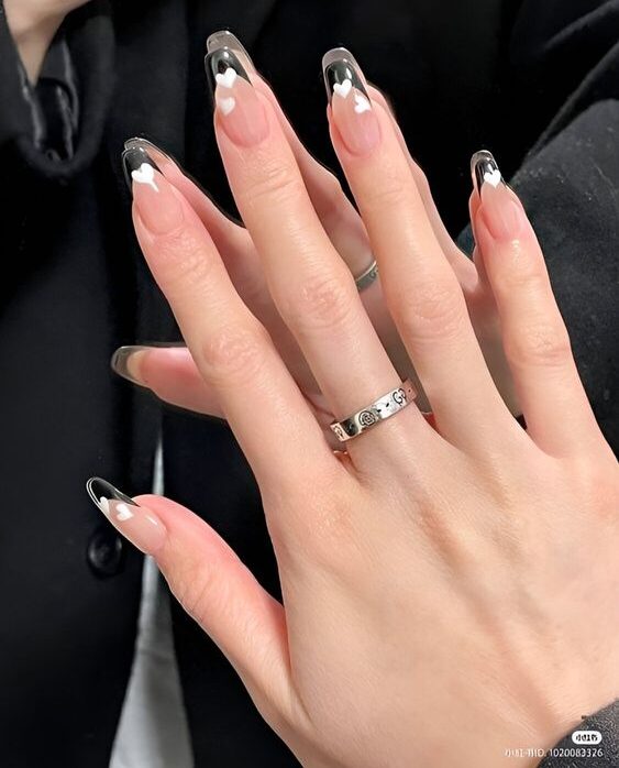 Long coffin shaped clear nails with white hearts nail design