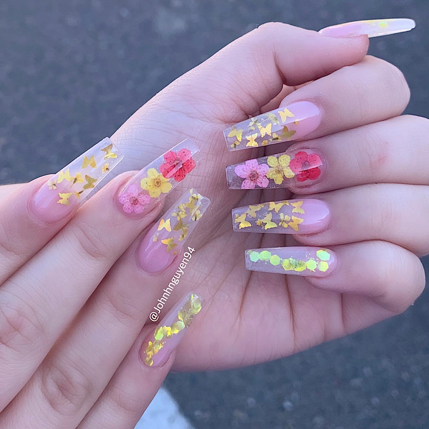 Long coffin shaped clear nails with flowers and gold butterflies nail designs