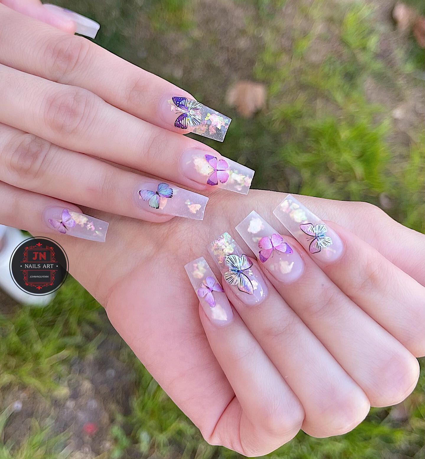 Long square shaped clear nails with butterflies nail designs