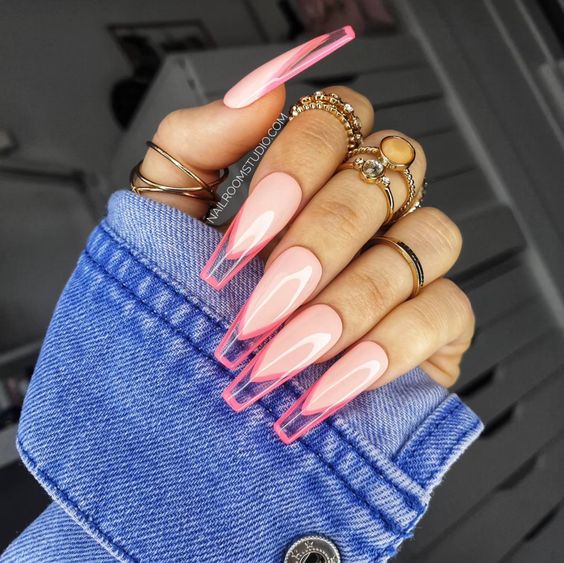 Long coffin shaped light pink nails with clear French tips and pink outlines