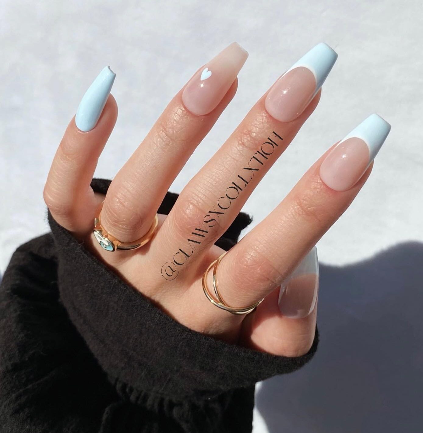 Long coffin shaped clear nails with pale blue French tips and little heart nail design