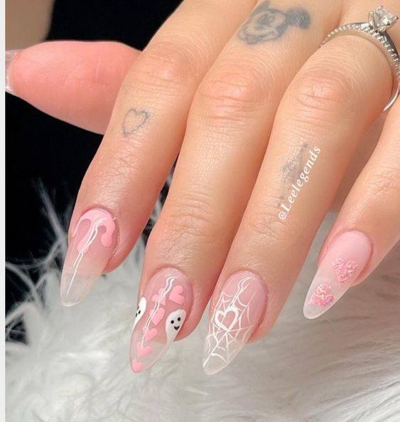 Clear almond nails with chic and spooky nail designs