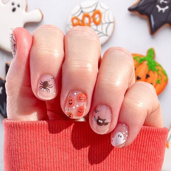 Natural short clear nails with Halloween-inspired nail designs