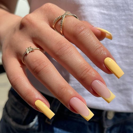 Yellow Manicure with Two French Tipped Nails