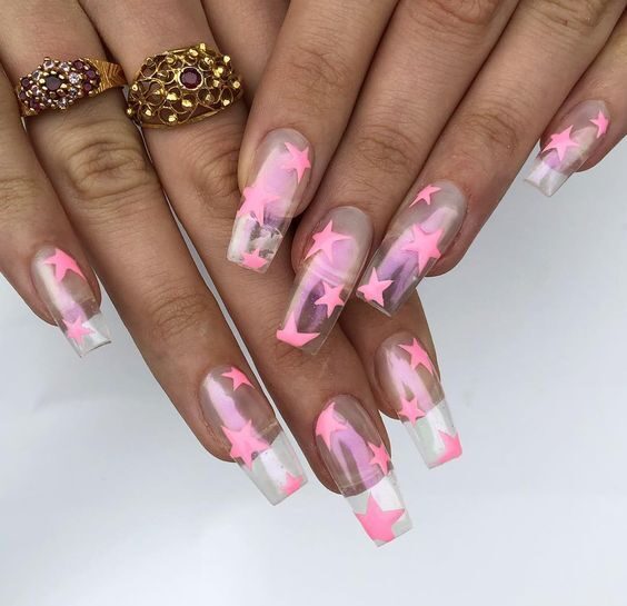 Long square shaped clear nails with pink stars nail art