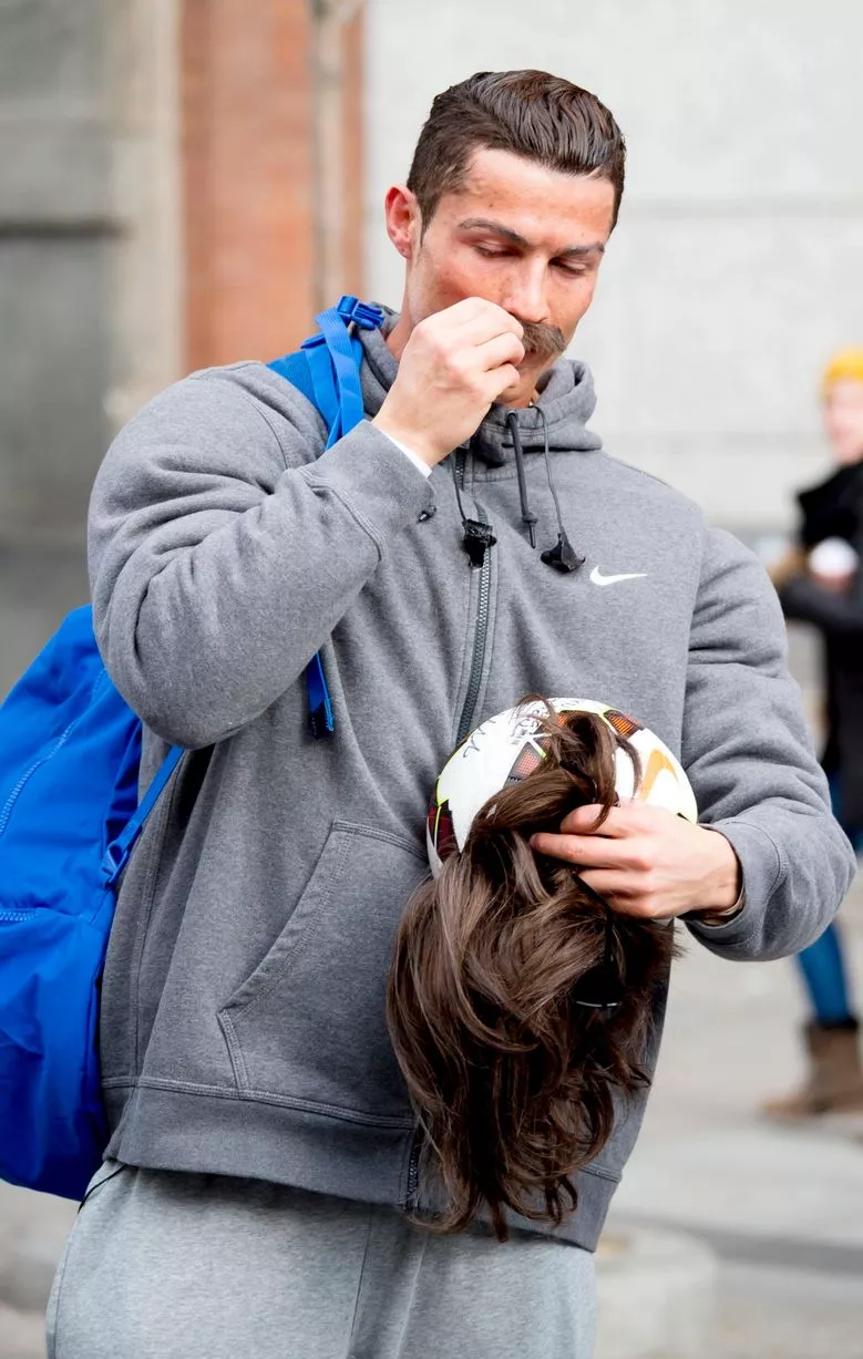 Cristiano Ronaldo, disguised as beggar, plays football with young boy in  Madrid square - Mirror Online