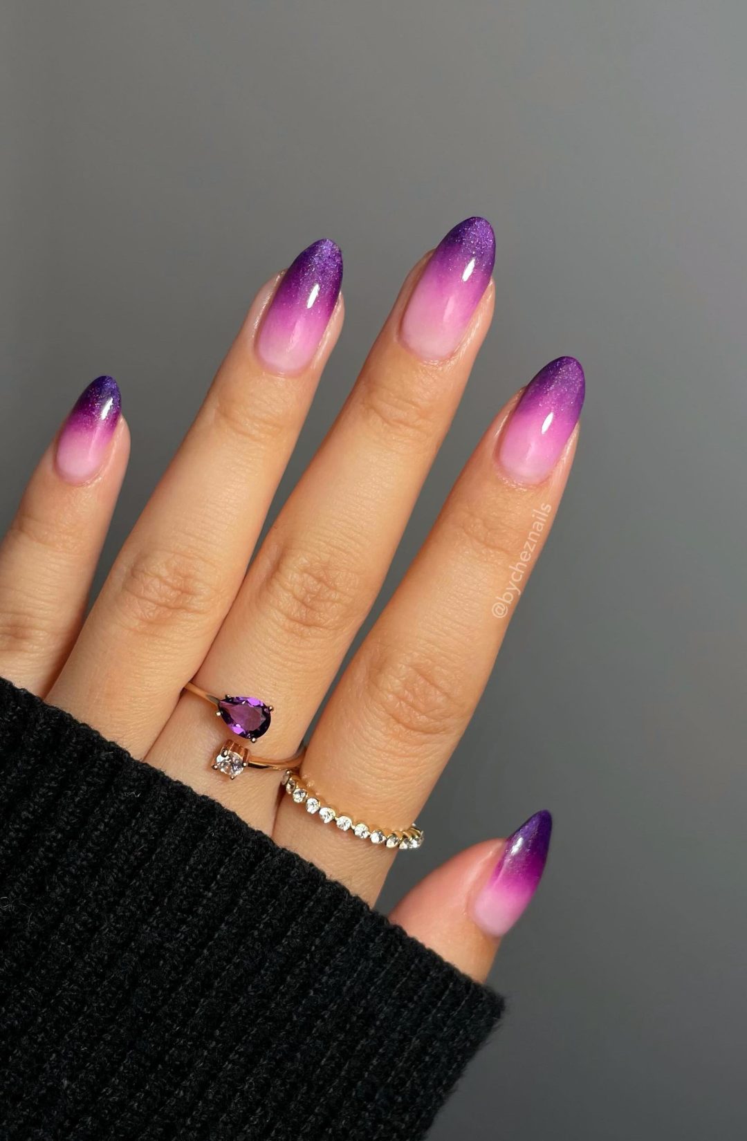 Dark purple ombre nails.