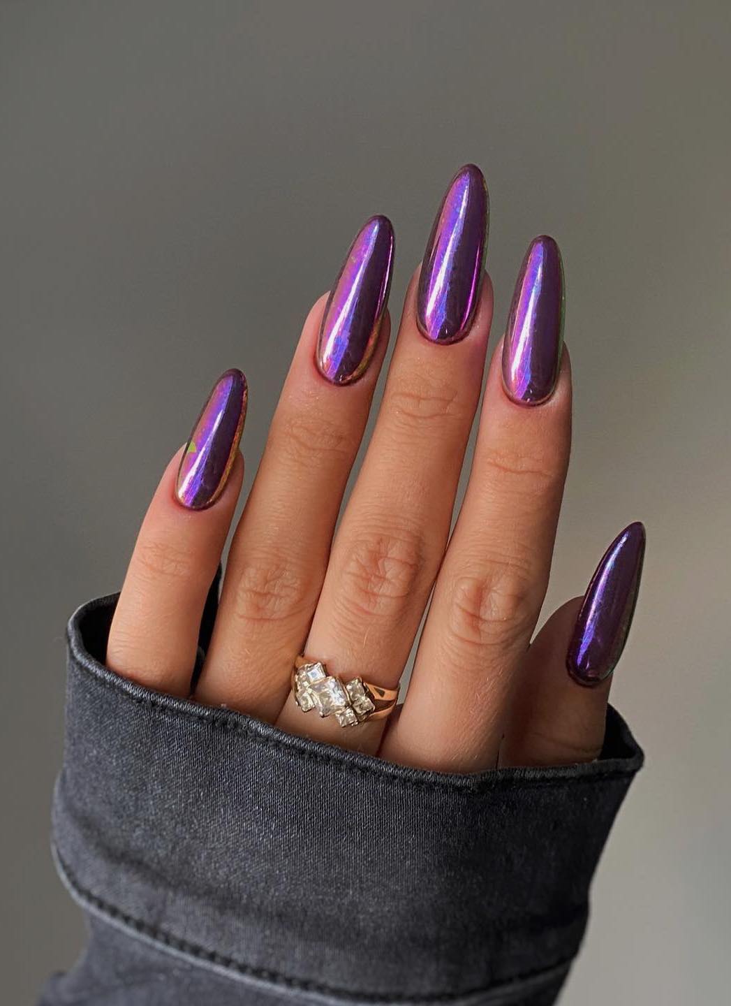 Long dark purple chrome nails.