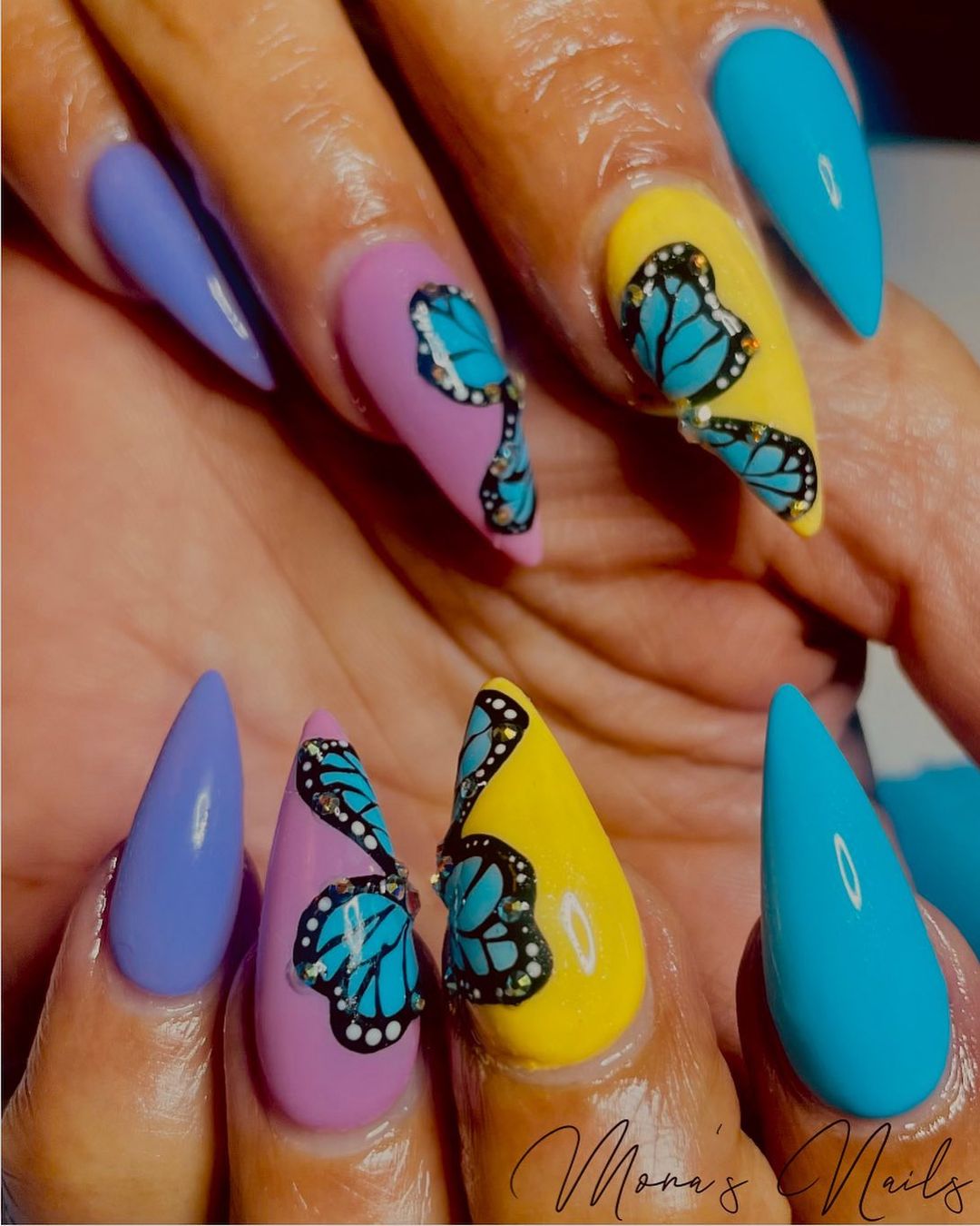 Isn't it great that two nails create one butterfly design? Just look how cute it is. This nail design is super cool for sunny days.