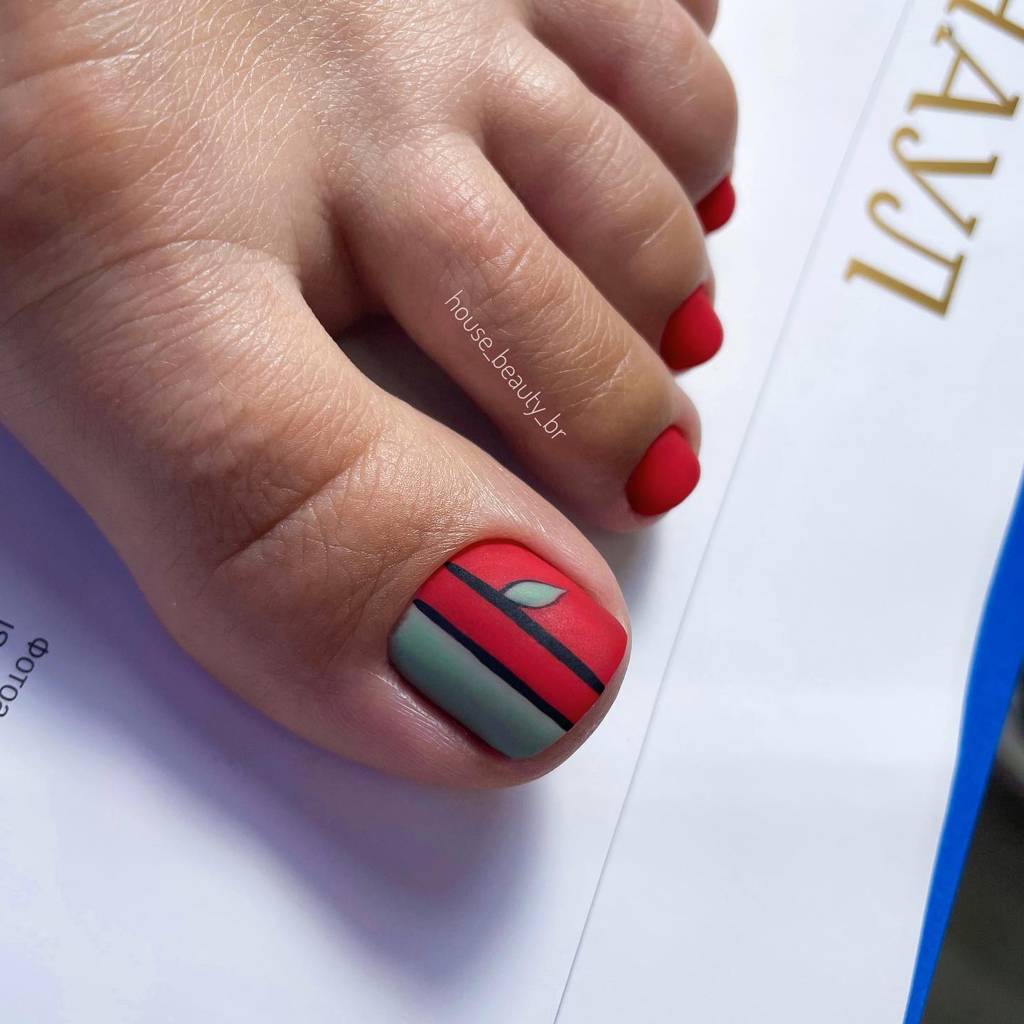 Matte Red Pedicure with Black Line Design