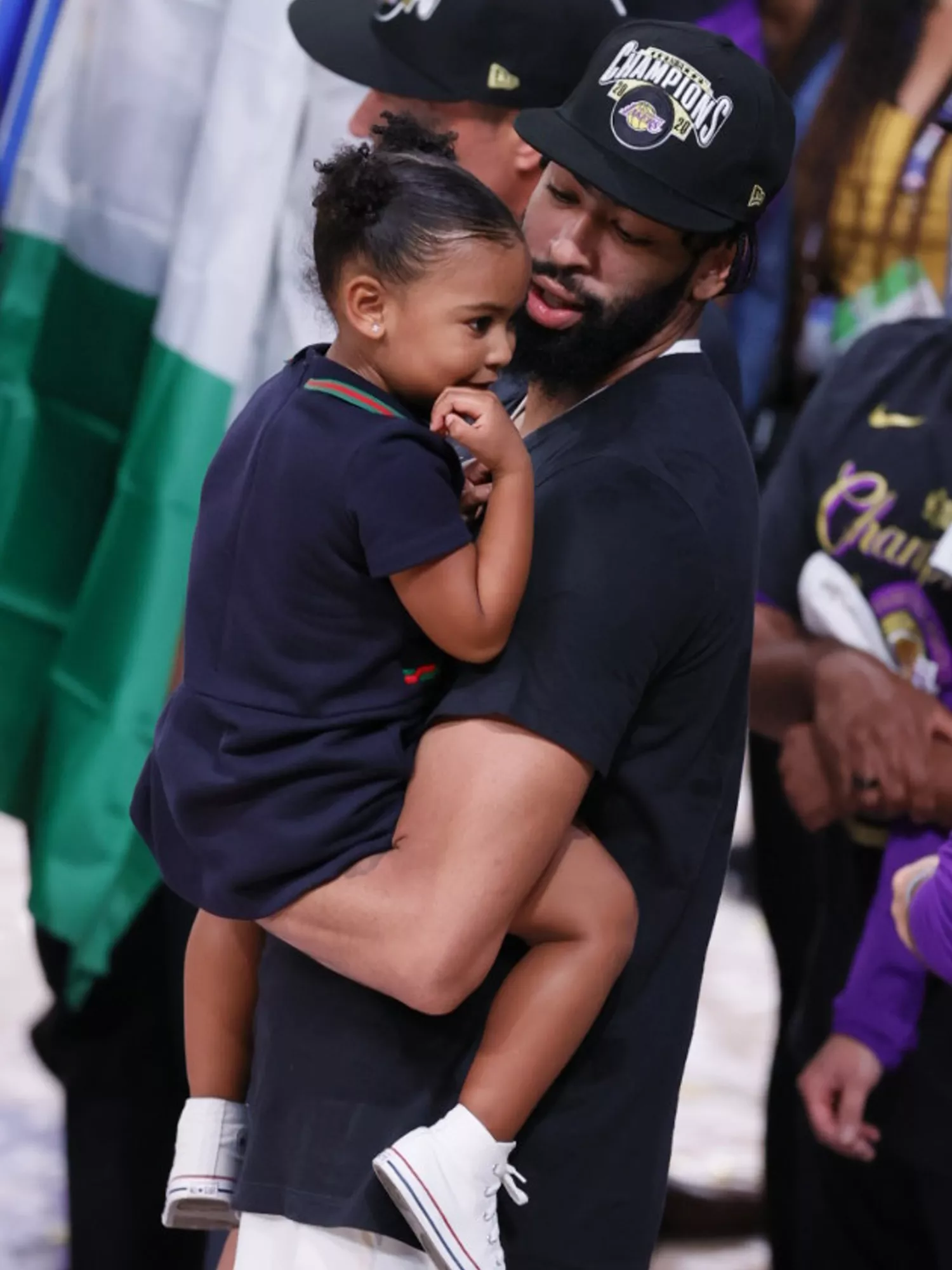 Anthony Davis holding his daughter Nala after winning the game and series during the 2020 NBA Finals.