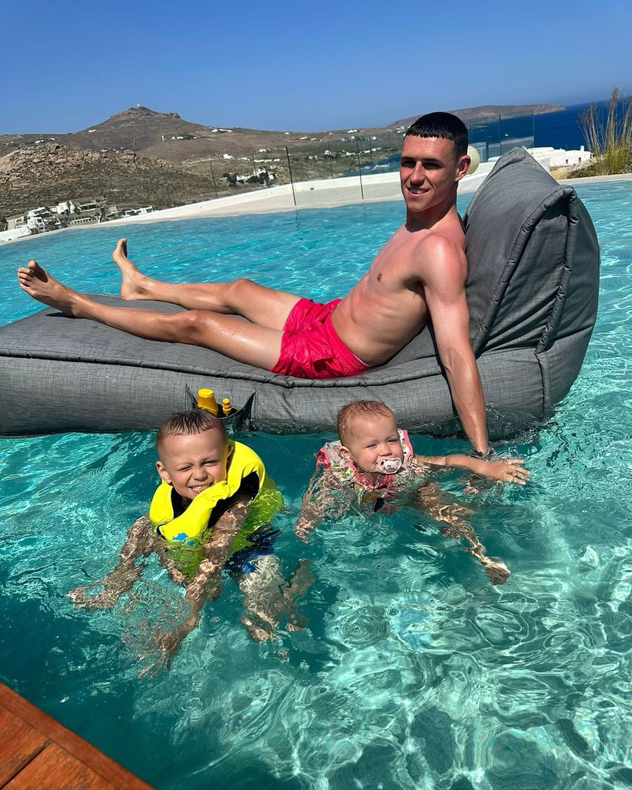 City ace Foden shows off his brood on a family holiday