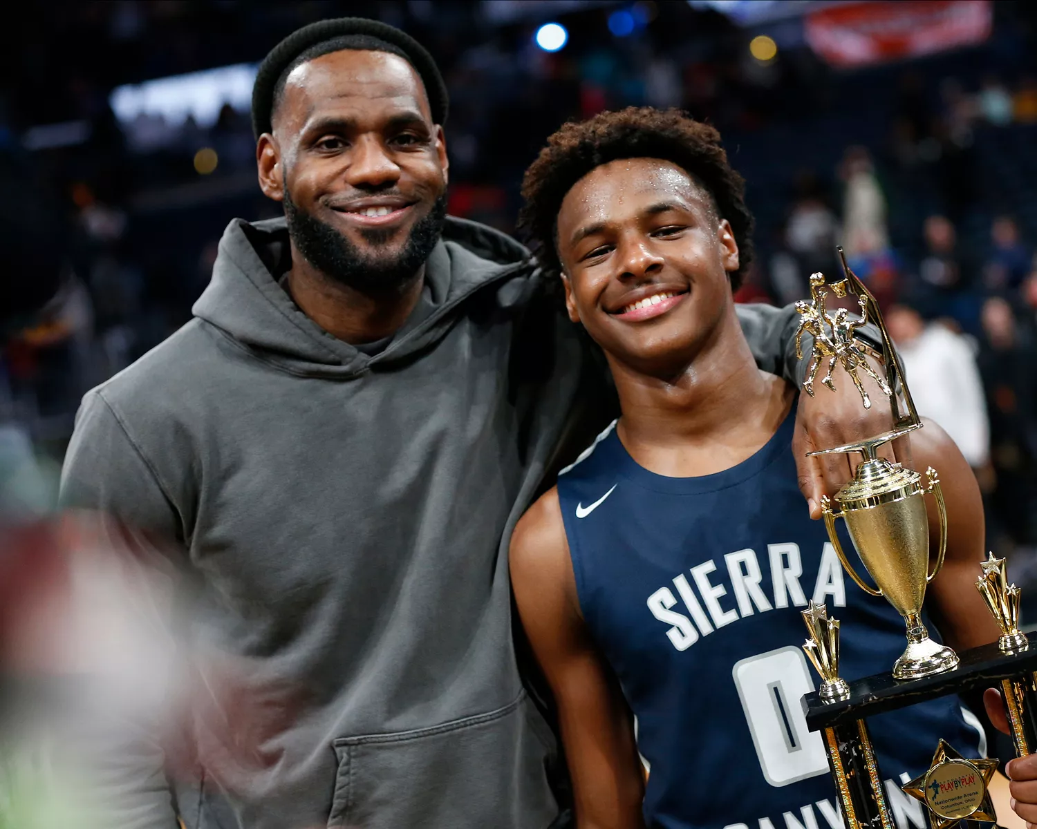 LeBron James, left, poses with his son Bronny after Sierra Canyon defeated Akron St. Vincent-St. Mary in a high school basketball game Dec. 14, 2019