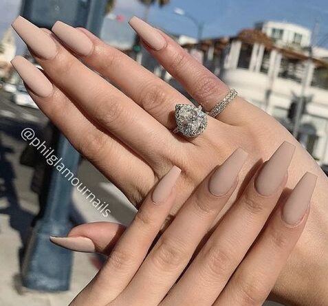 Plain neutral shade nail polish in matte finish on long coffin nails