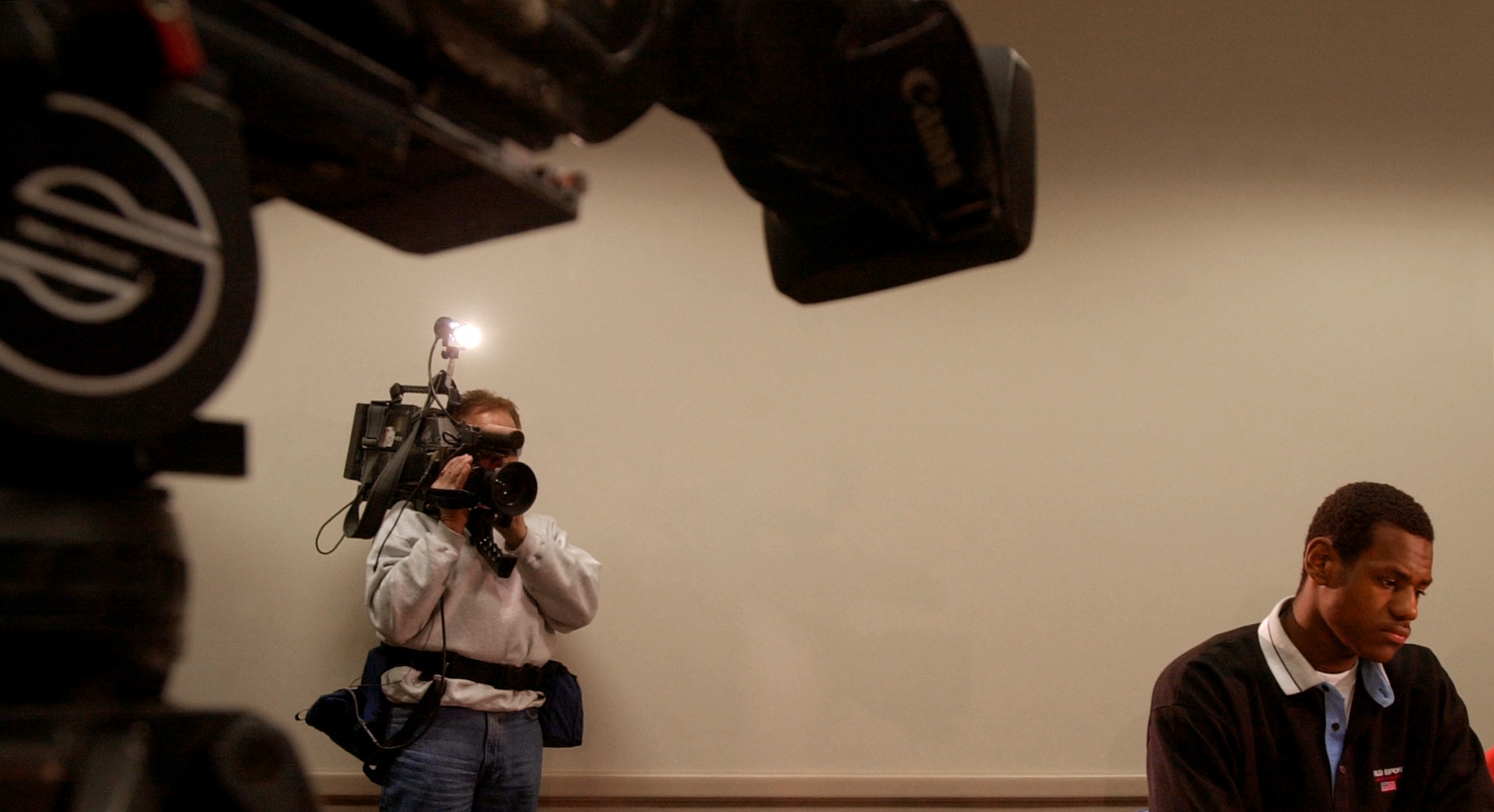 St. Vincent-St. Mary's star basketball player LeBron James tries not to be daunted by the media exposure during a press conference at Cleveland State University's Convocation Center January 10, 2002.  (John Kuntz/The Plain Dealer)