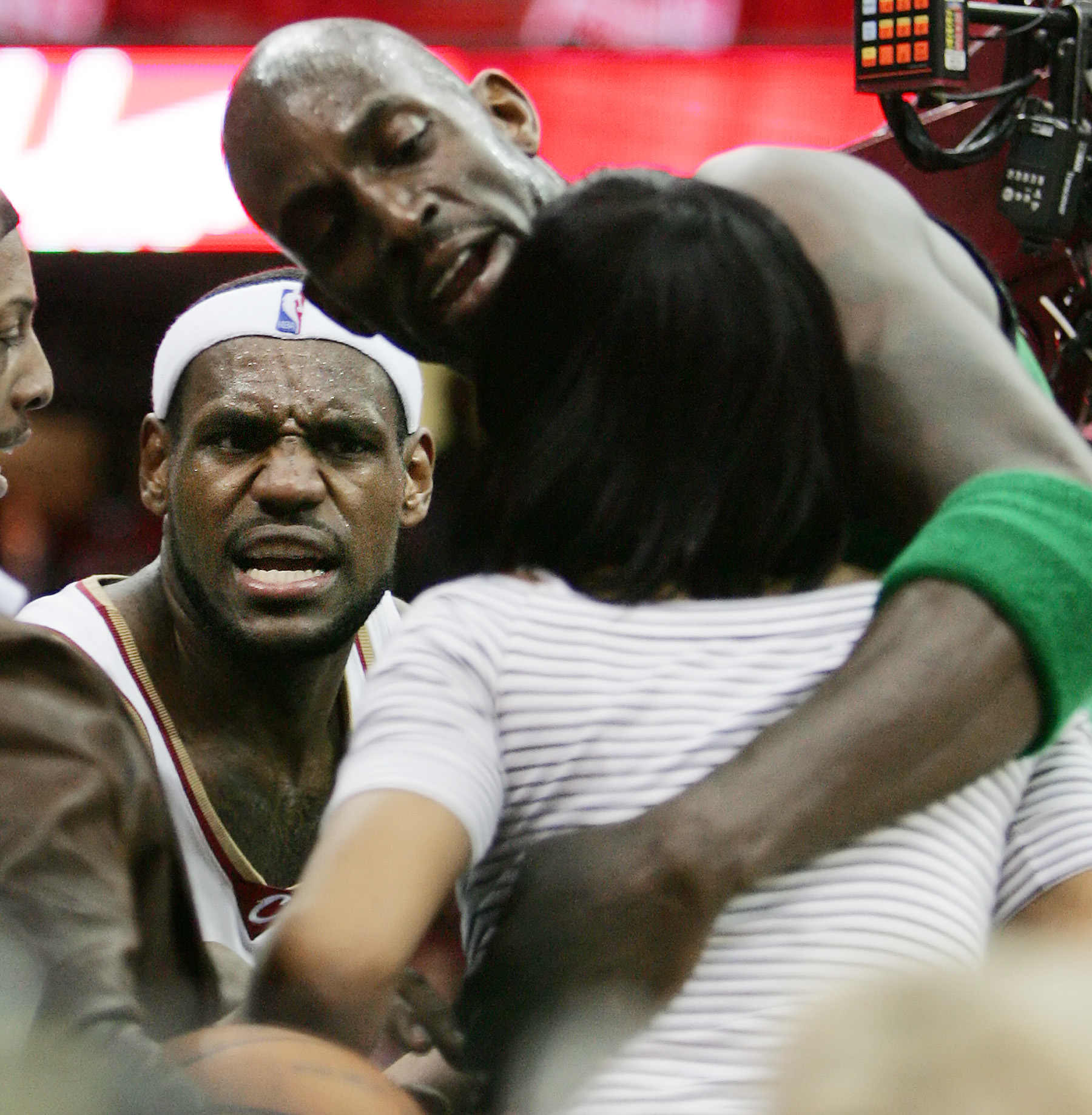 Cleveland Cavaliers LeBron James yells at his mother Gloria as Boston Celtics Kevin Garnett tries to hold her back when a play where Celtics Paul Pierce grabbed LeBron to stop him from a layup in the second period of game 4 of the Eastern Conference semi-final round May 12, 2008 at Quicken Loans Arena in Cleveland.  (John Kuntz / The Plain Dealer)