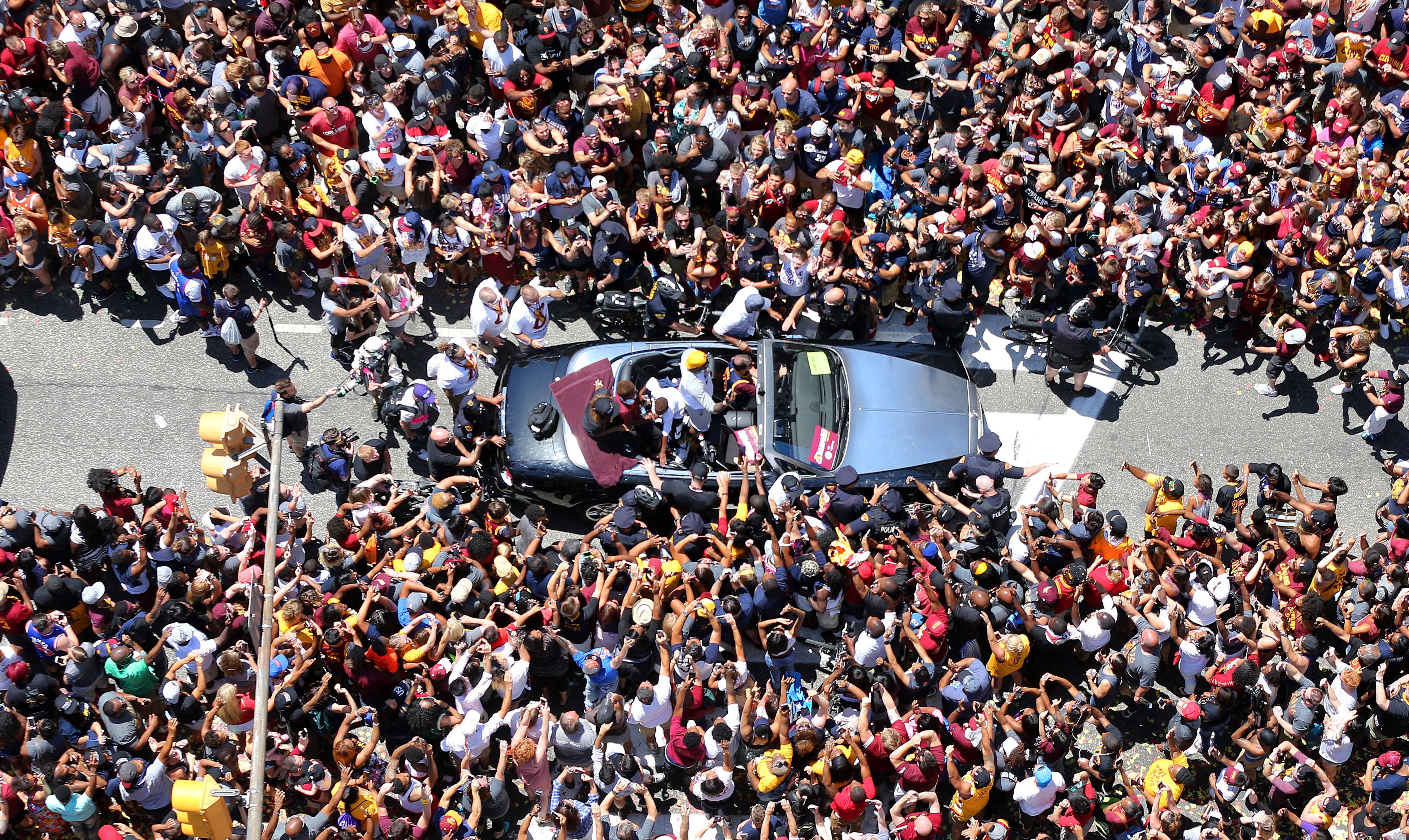 Cleveland Cavaliers forward LeBron James's Rolls Royce is swarmed by fans during a parade in downtown Cleveland to celebrate and honor the 2016 NBA Champion Cleveland Cavaliers.    Joshua Gunter, cleveland.com June 22, 2016. Cleveland.