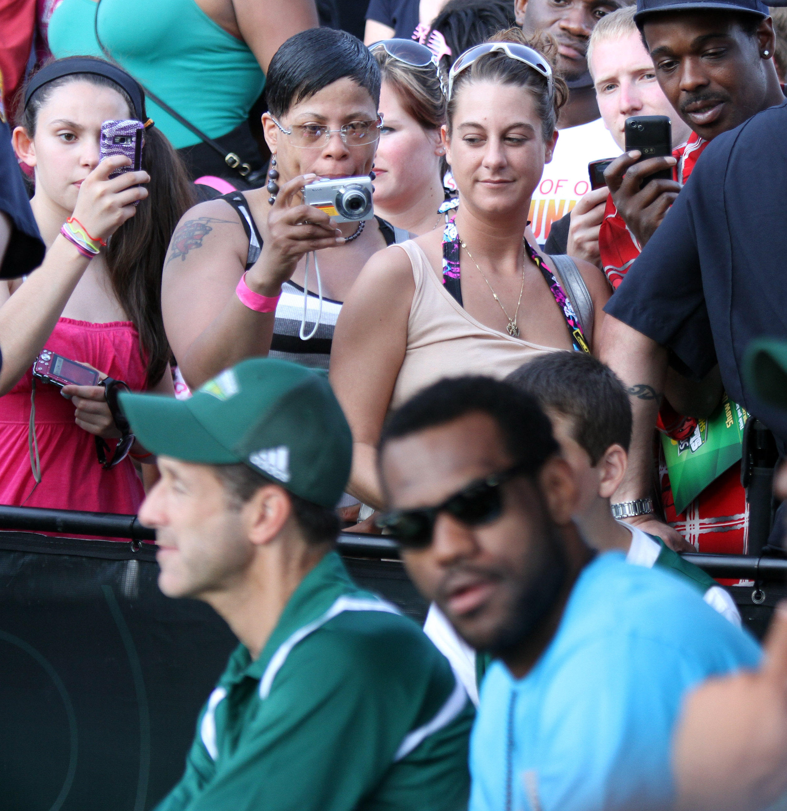 Fans snap photos of LeBron James during the Cleveland Sprite Slam Dunk Showdown at Time Warner Cable Amphitheater Saturday, May 29, 2010 at Tower City in Cleveland.  James kept the crowd waiting for about 45 minutes before showing up.  (Joshua Gunter/ The Plain Dealer)