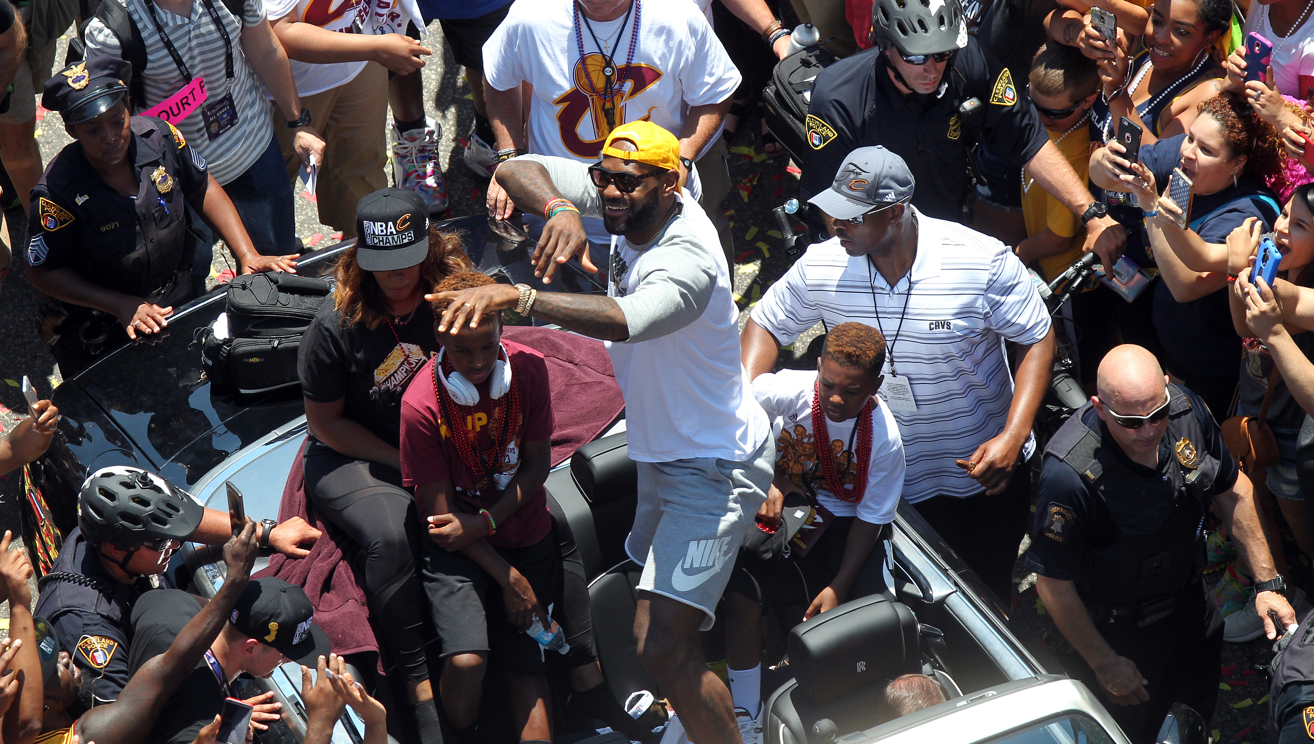 Cleveland Cavaliers forward LeBron James points to the fans during a parade in downtown Cleveland to celebrate and honor the 2016 NBA Champion Cleveland Cavaliers.    Joshua Gunter, cleveland.com June 22, 2016. Cleveland.