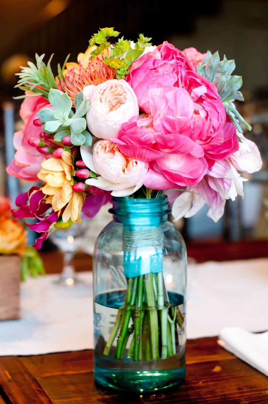 Bridesmaid's Bouquet Resting in Mason Jar